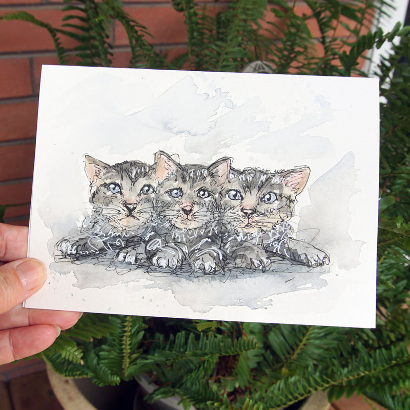 Hand-drawn greeting card of kittens