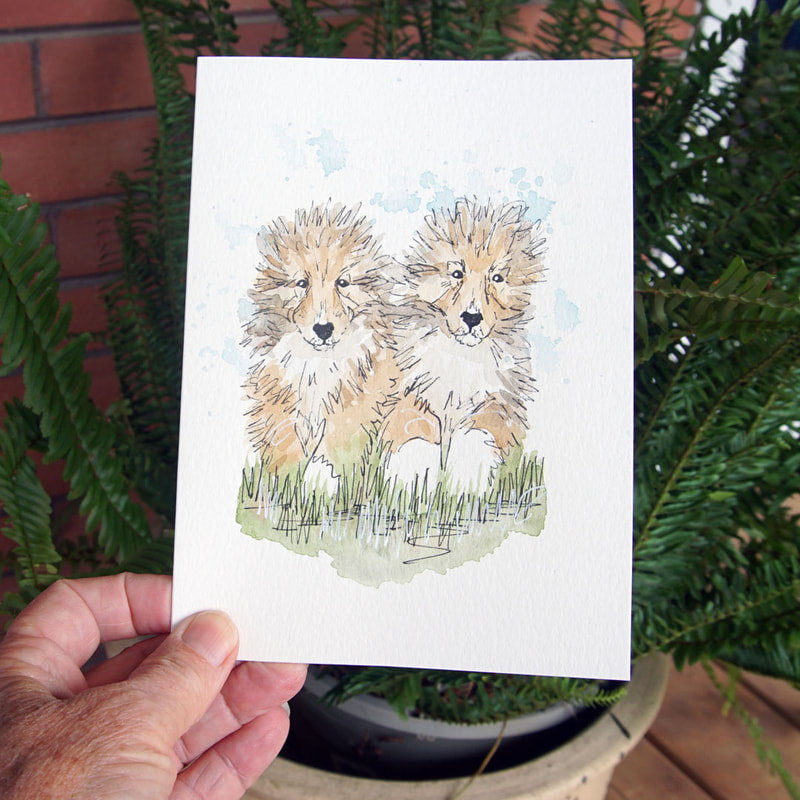 Hand-drawn greeting card of a couple of puppies